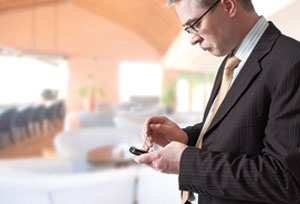 man-with-handheld-device-300px